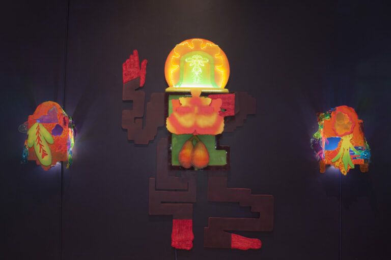 Mixed media neon relief sculpture with LED lights and inflating latex lungs in the central body.