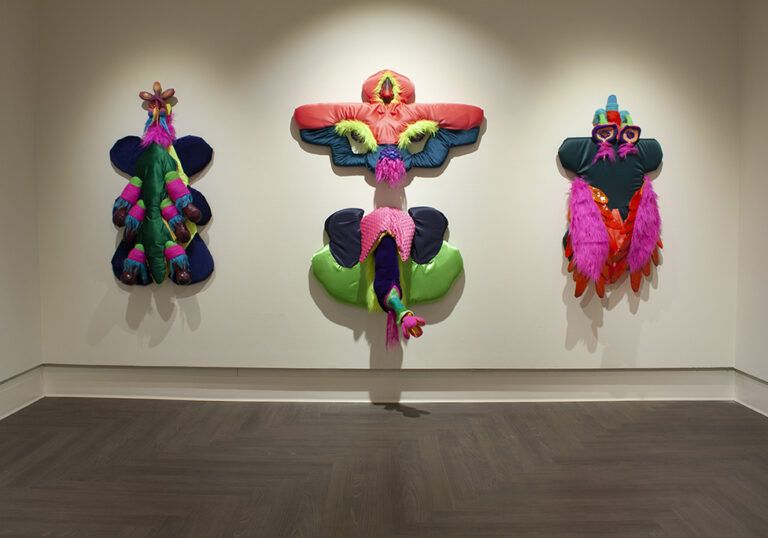 "Mixed media relief sculpture. These are primarily upholstered fabric forms. This body of work was inspired by Darwin's exhaustive treatise on orchid sexuality and reproduction. Orchid reproduction is most often framed as "deceptive" which is a word frequently deployed against gender nonconforming bodies. This triptych configuration is meant to place the sculptures as devotional figures, a form of reverence toward nonconforming bodies and natural exuberance." - Andrea Pérez Bessin