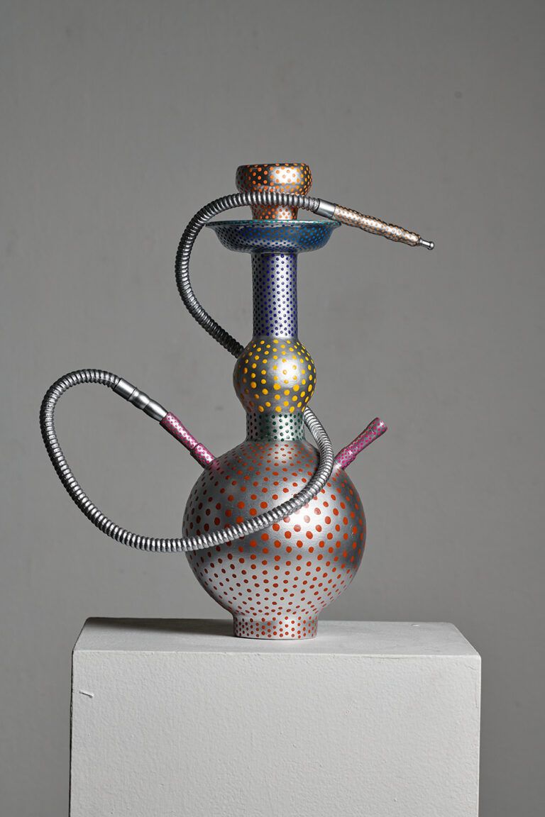 Hookah pipe decorated like a carnival mask and unable to be used.