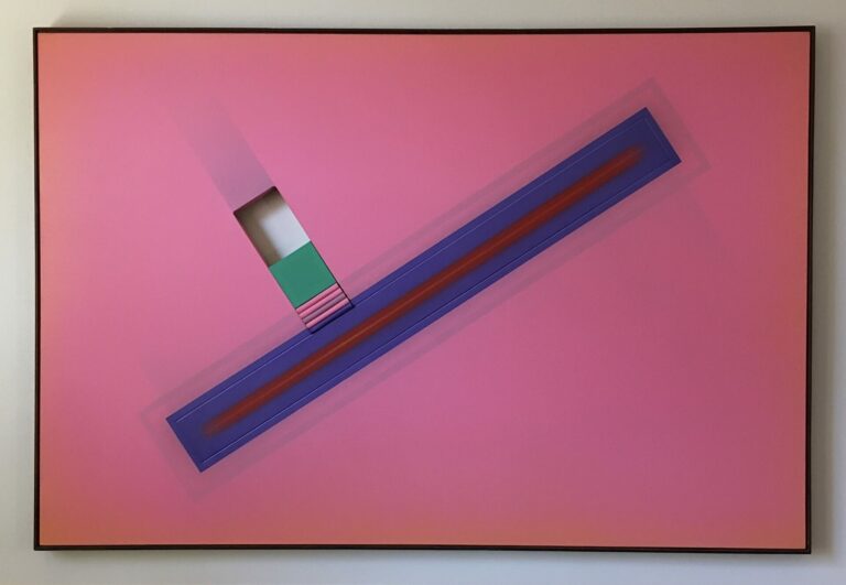 A pink color field painting where a blue rectangle radiates a glow from its sides. The center of the blue rectangle is a red line. Intercepting the blue rectangle is a hole in the canvas and a small green square painting is inserted. Underneath the green square are pink ridges.
