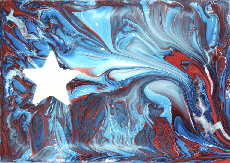 Red, white, and blue paint pour with a white star on the left to mimic the Puerto Rican flag.