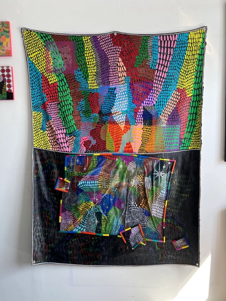 Painting divided horizontally into bold colorful side (top) and patterned colorful center surrounded by black (bottom).