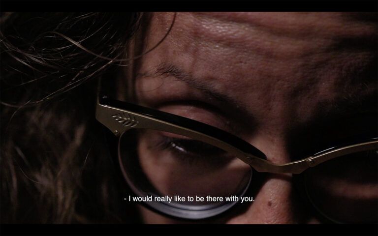 A two-channel video installation that reflects on the distanced experience of an imminent natural disaster. "I would really like to be there with you."