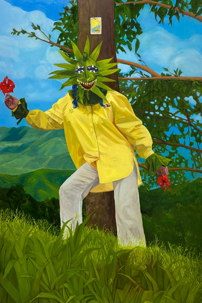 "This is an oil painting based on the design of the Rider-Waite tarot card 'The Fool'" - Isabella Mellado. A person wearing a vejigante mask holds hibiscus flowers in each hand. They wear a yellow shirt with the progress pride flag on the right side of the shirt and a Taino symbol on the left. They stand ankle deep in thick grass with their back to a tree that has "The Fool" tarot card nailed to it. Mountains are sprawling in the background against a bright blue sky.