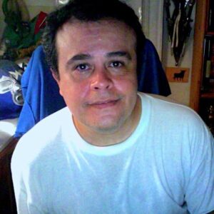 Artist Miguélàngel Ruiz. He smiles at the camera.