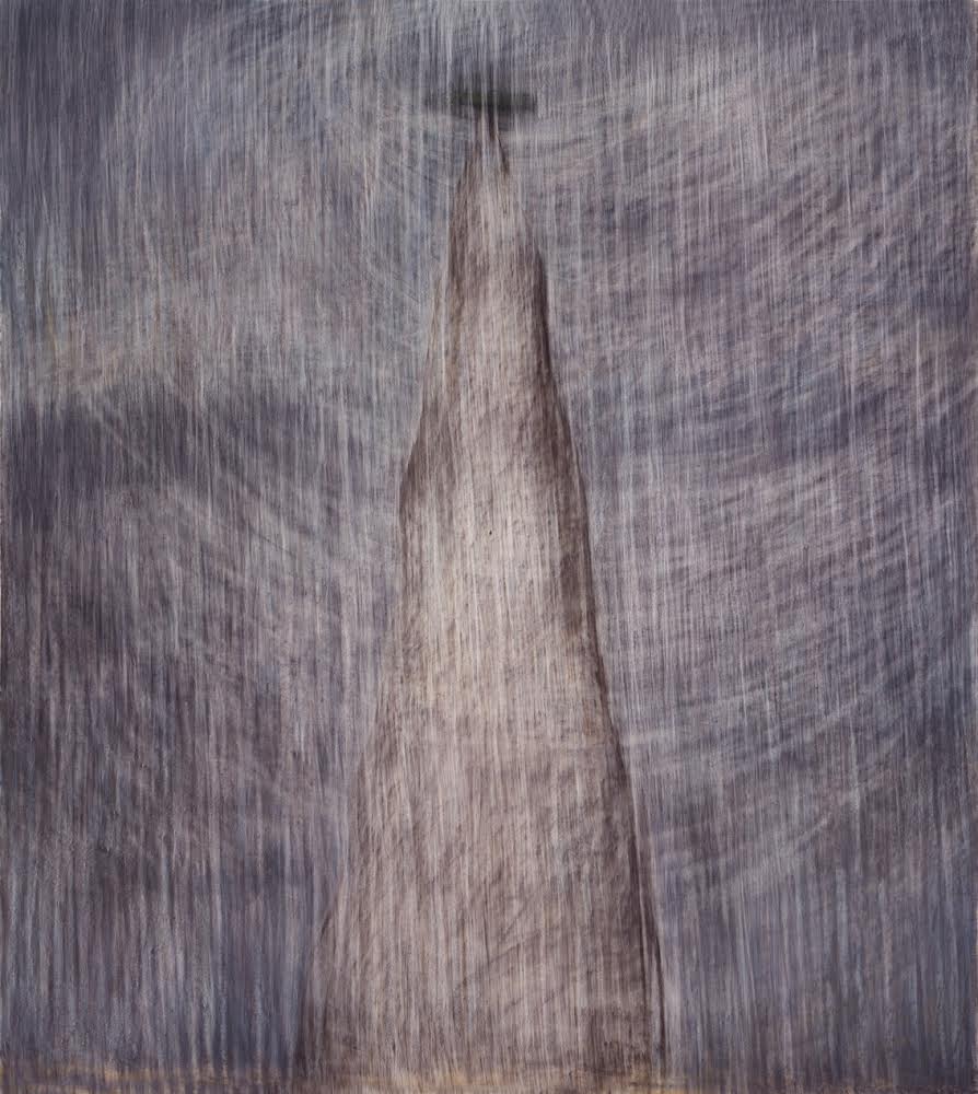 A tall mountain shape with lines mimicking winds and rain surrounding the point.