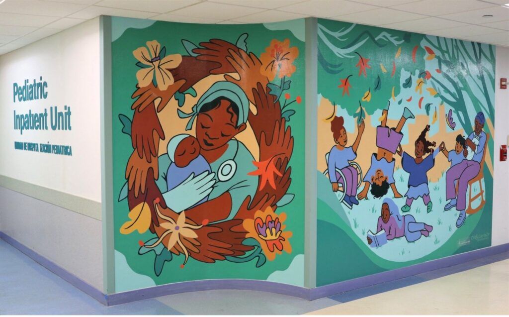 Mural of a nurse and child next to a mural of people playing.