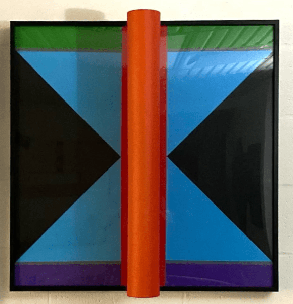 A constructivist painting/sculpture of two dark triangles pointing to the center of the canvas where there is a red appendage bursting from the flat plane. The top border is green and the bottom border is purple.
