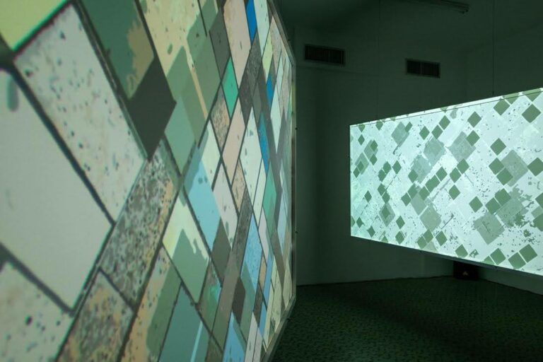 Installation of works that look like the square and blocky aerial view of farmland from a plane.