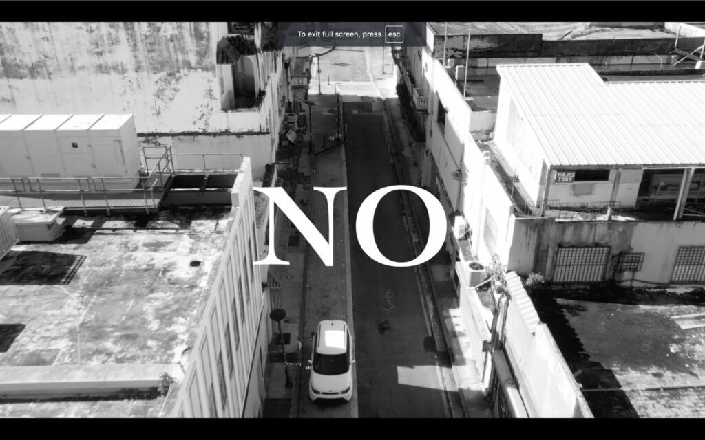 Title page still from "No" (2022). Black and white image with the text  "NO" large in white.